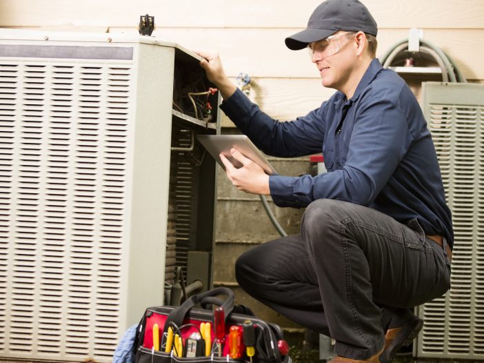 Professional working on an HVAC system